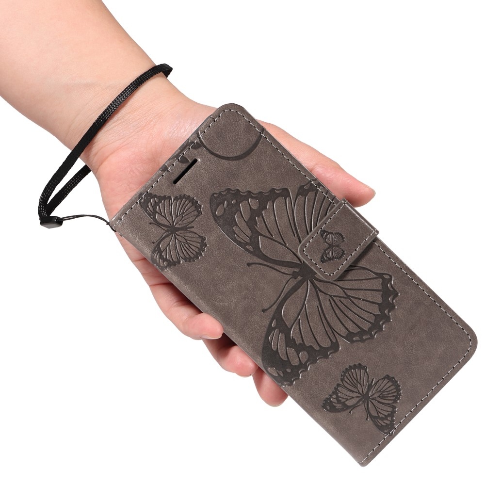 Nagy pillangó könyv tok Xiaomi Redmi Note 14-hez - szürke