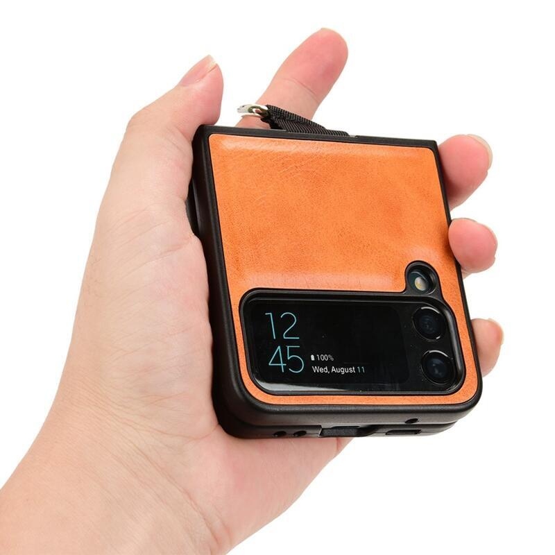 Gyűrűs műanyag borítás PU bőrrel bevont hurokkal a mobiltelefonra Samsung Galaxy Z Flip4 5G - narancssárga