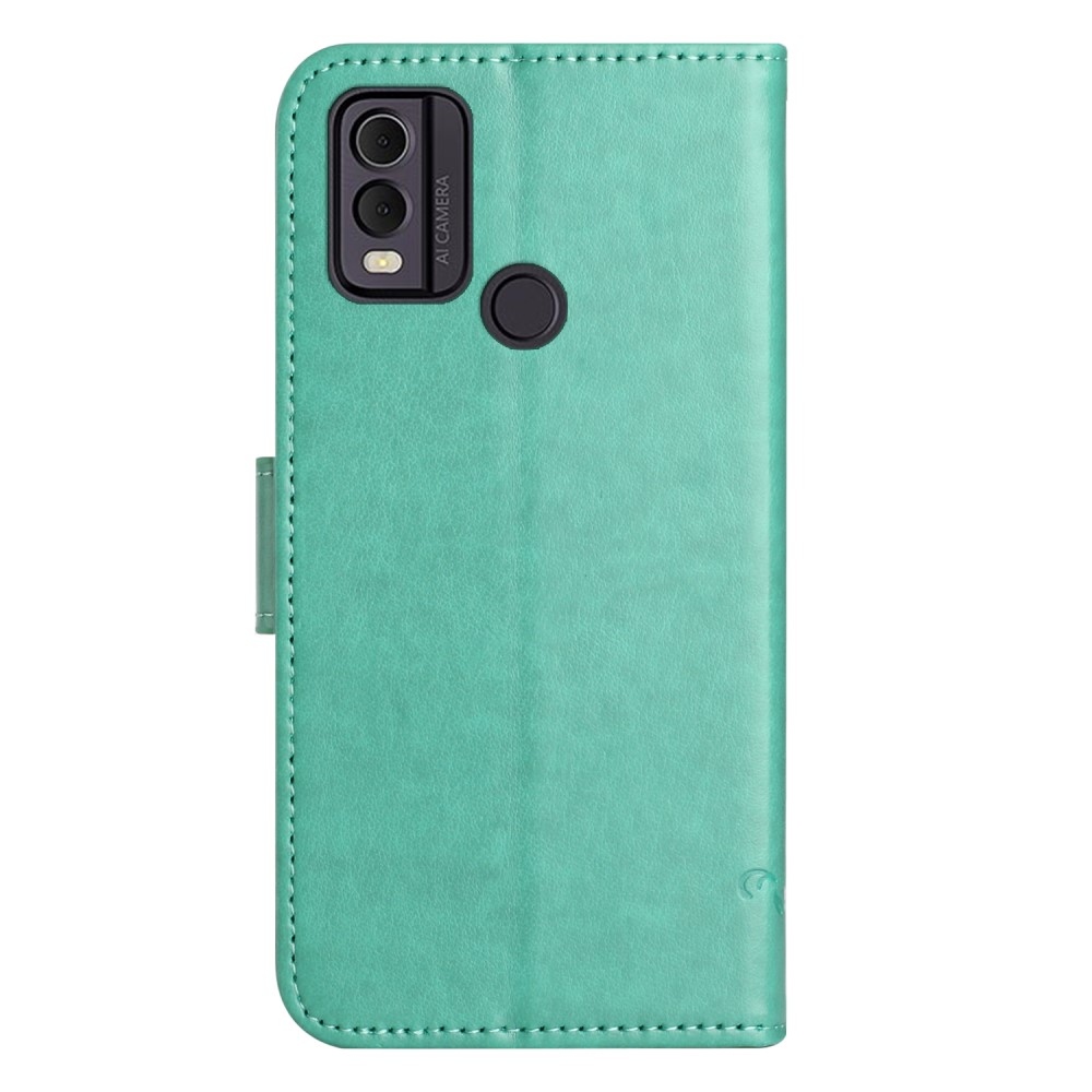 Virágos könyvtáska a Nokia C22 készülékhez - teáskék színű